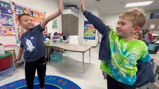  Students giving each other a high five